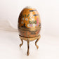 Vintage Medium Brass Egg Lidded Container with Floral Designs and Brass Stand (Glows)