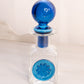 Vintage Rainbow Glass Clear Perfume Bottle with Blue Stopper Flower Accent
