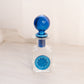 Vintage Rainbow Glass Clear Perfume Bottle with Blue Stopper Flower Accent