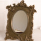 Antique Dark Gold Tone Metal Standing Mirror with Ornate Designs