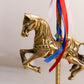 Medium Brass Carousel Horse Figurine with Red, White, and Blue Ribbon